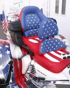 Custom motorcycle seat and backrest upholstered in red, white and blue stars-and-stripes vinyl by Premier Auto Upholstery in Vacaville